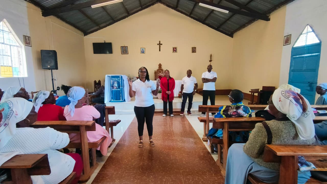 A Mindful Learning team member speaking with a community group